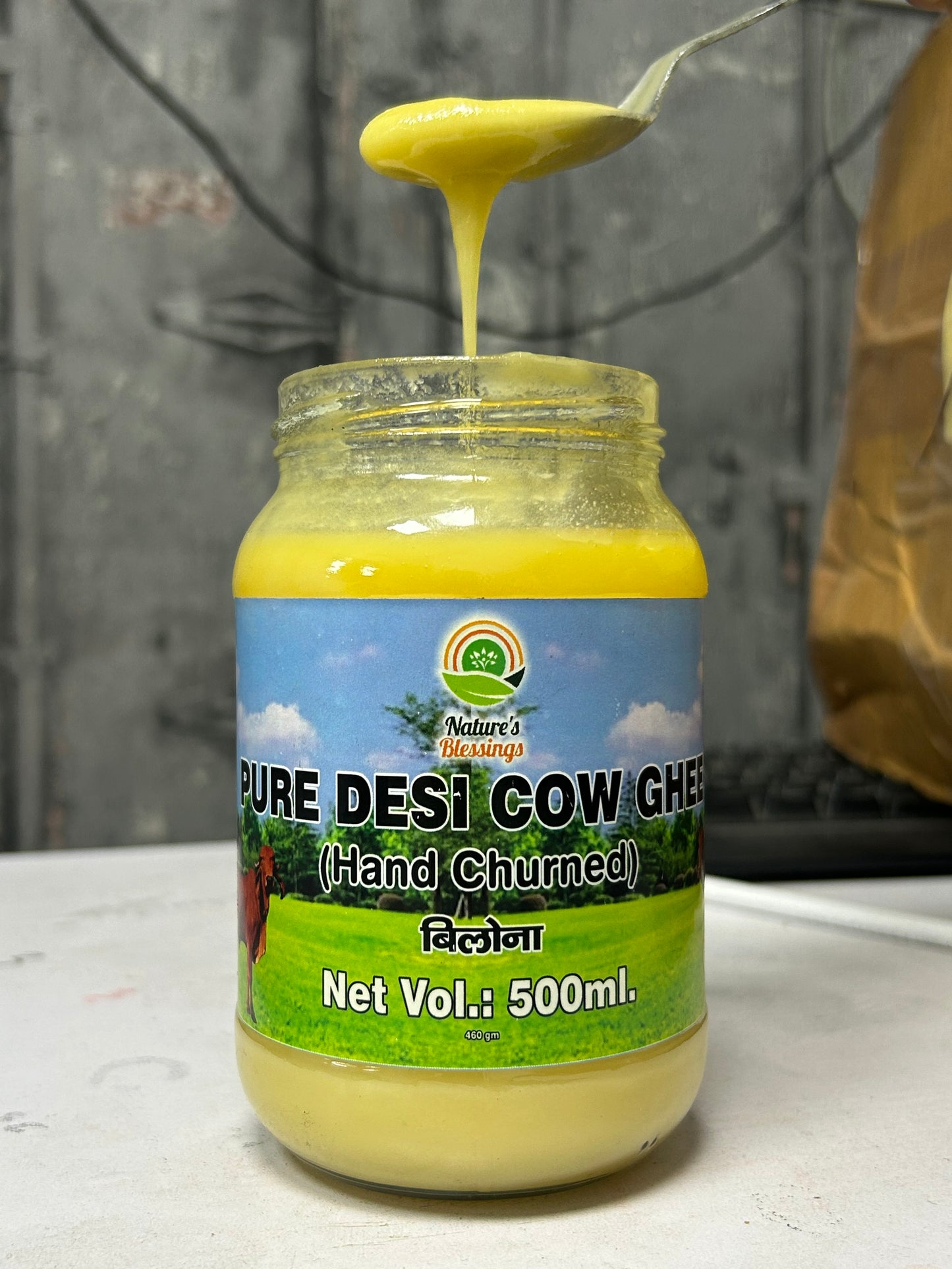  Golden A2 cow ghee in a jar, symbolizing purity and rich flavor, made from desi cow milk, ideal for cooking and Ayurveda."